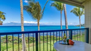 A balcony with a view of the ocean and palm trees. - Napili Shores I-269 - Direct Oceanfront:  Summer and Fall Savings!  Free Activities! (Napili)