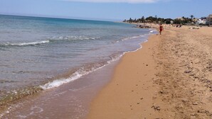 A beach with clear skies and calm waters.
