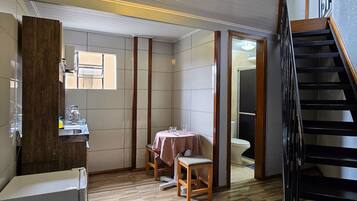 Standard Apartment, Kitchen | Private kitchen | Microwave, cookware/dishes/utensils, cleaning supplies