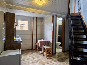 Standard Apartment, Kitchen | Private kitchen | Microwave, cookware/dishes/utensils, cleaning supplies