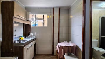 Standard Apartment, Kitchen | Private kitchen | Microwave, cookware/dishes/utensils, cleaning supplies