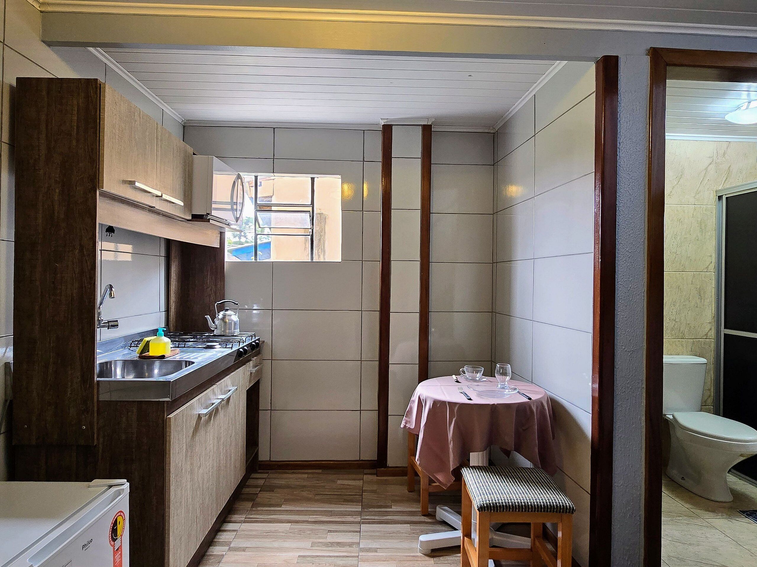 Standard Apartment, Kitchen | Private kitchen | Microwave, cookware/dishes/utensils, cleaning supplies