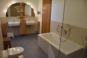 Bathtub, hair dryer, towels, soap