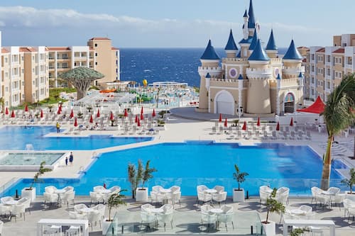 7 outdoor pools, open 10:00 AM to 7:00 PM, pool umbrellas, sun loungers