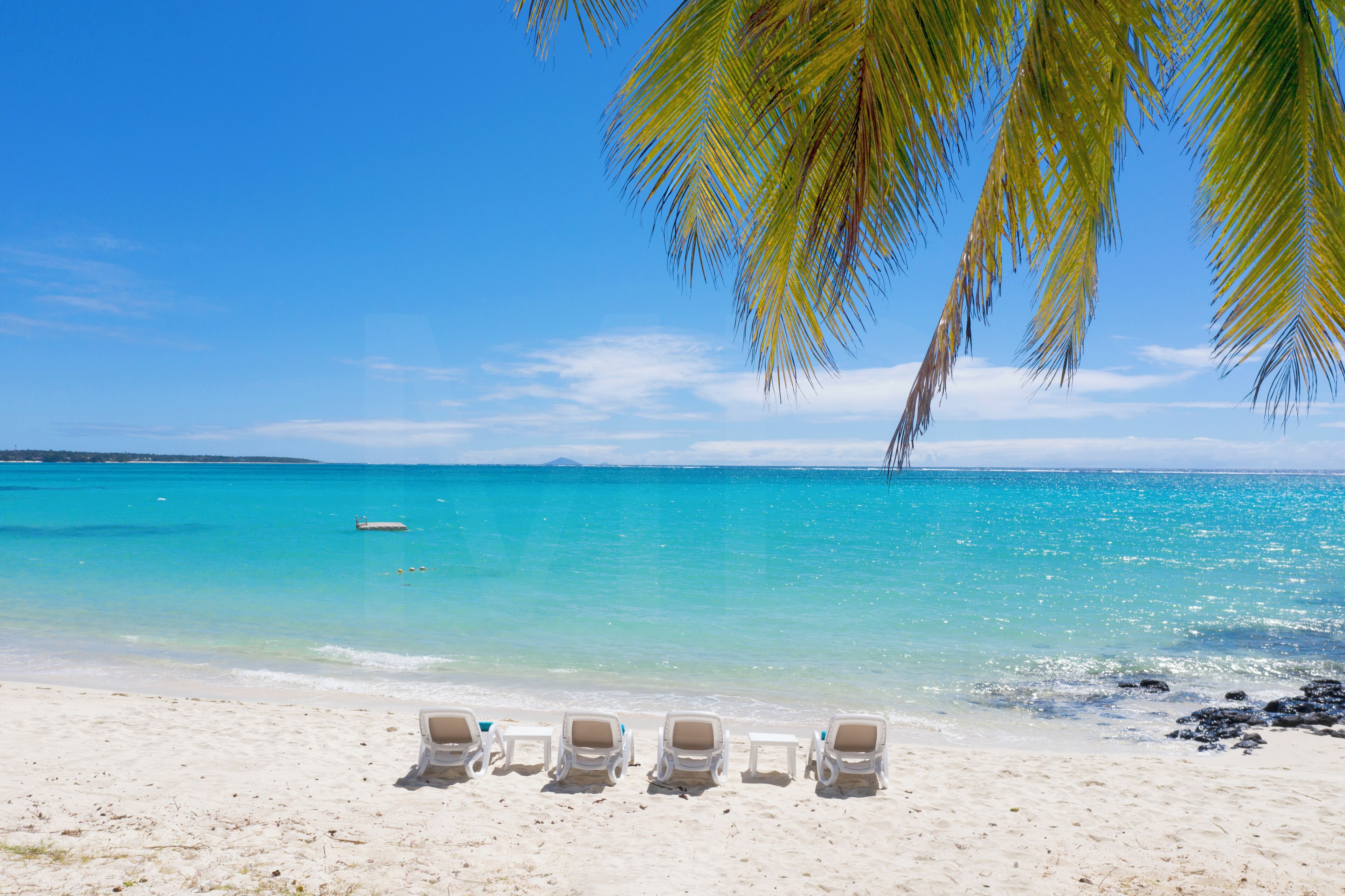 On the beach, sun-loungers, beach towels