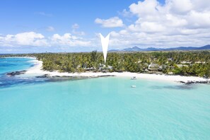 On the beach, sun loungers, beach towels
