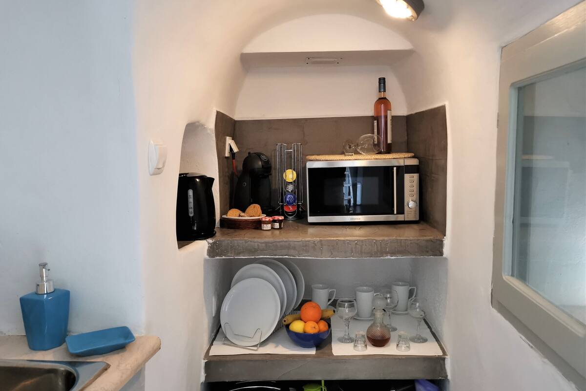 full-sized fridge, microwave, stovetop, espresso maker