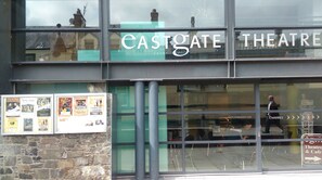 A theater building with a sign reading 'CASTGATE THEATRE' and a glass entrance. - A cosy studio apartment in an idylic location on the banks of the river Tweed (Peebles)