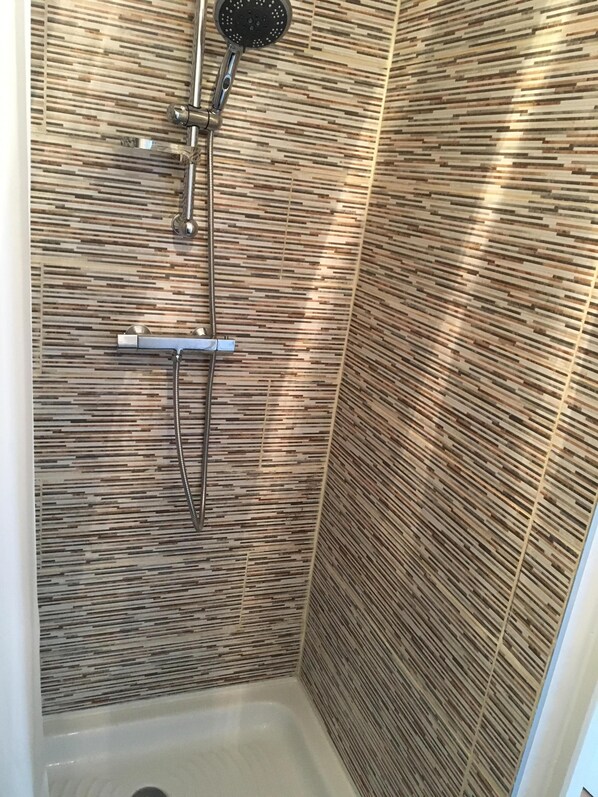 Shower, towels, soap, shampoo
