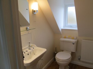 Bathtub, hair dryer, towels, soap