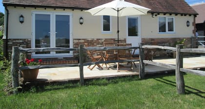 Conversion de grange dans un endroit magnifique, paisible et rural avec une vue imprenable.