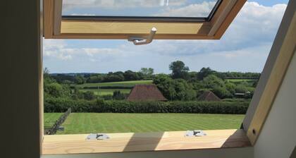 Conversion de grange dans un endroit magnifique, paisible et rural avec une vue imprenable.