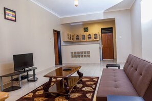 Executive Suite | Living area | TV - Sophies Signature Suites (Entebbe)