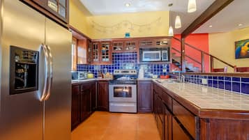 Fridge, microwave, stovetop, coffee/tea maker