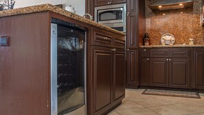 Enjoy cooking in this well-equipped kitchen with a dishwasher, oven, and range hood.
