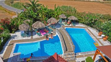 Outdoor pool, open 9:00 AM to 7:00 PM, pool umbrellas, pool loungers