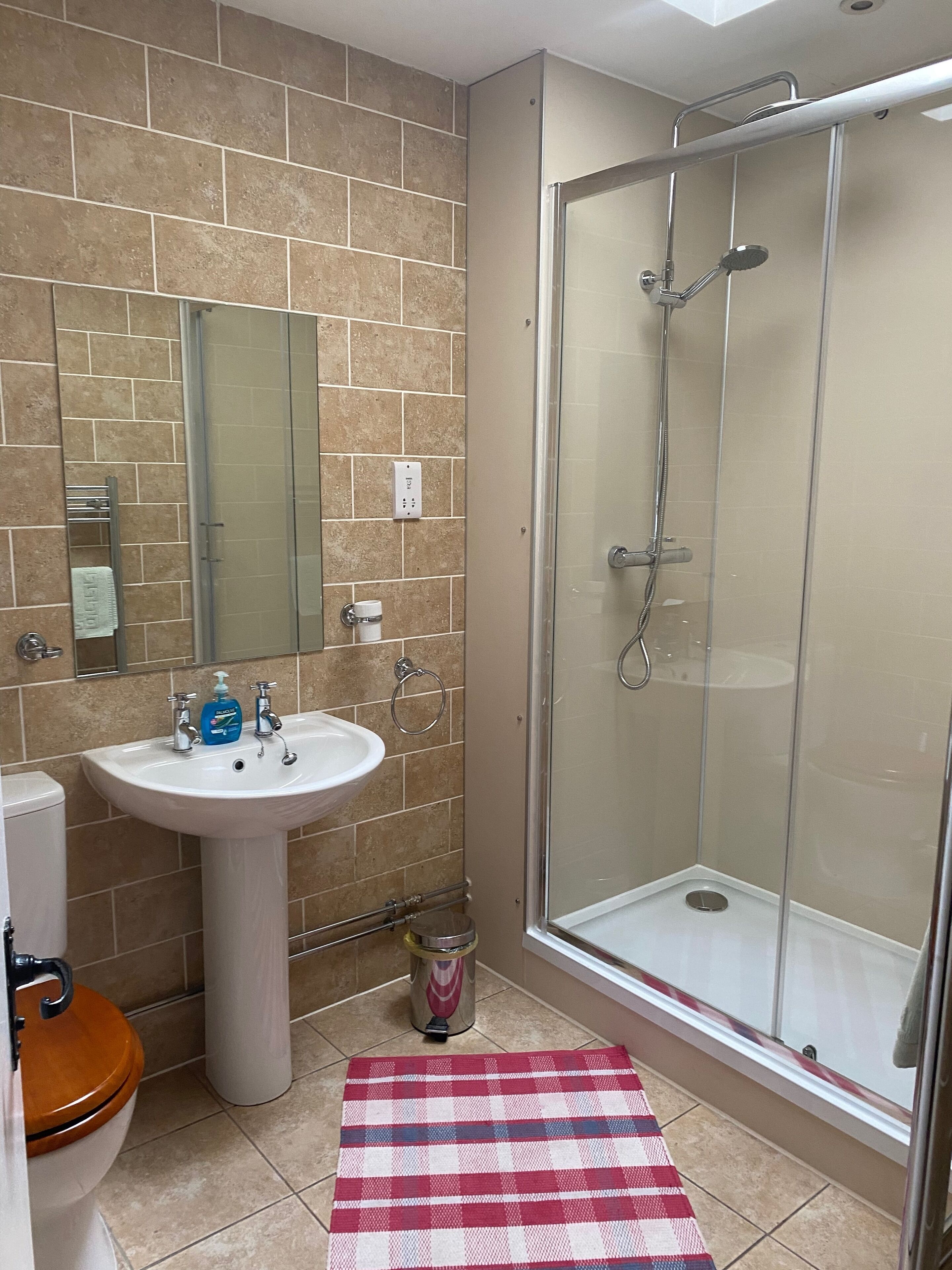 Combined shower/tub, hair dryer, towels, toilet paper