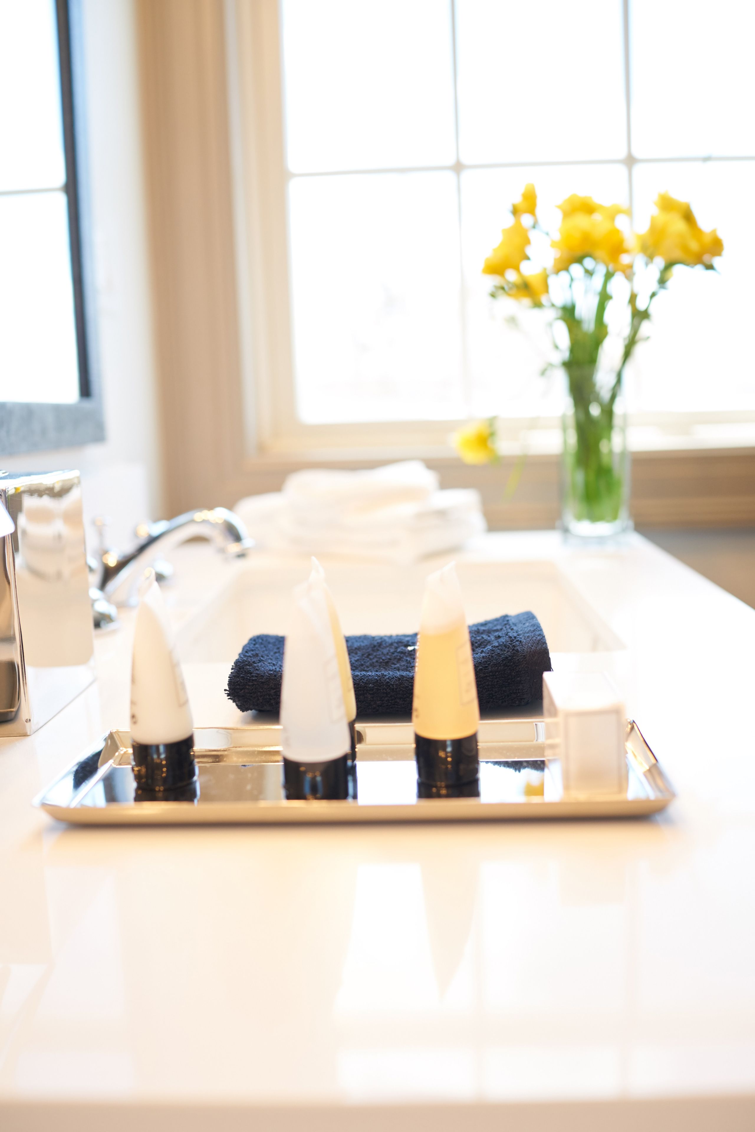 designer toiletries, hair dryer, bathrobes, towels