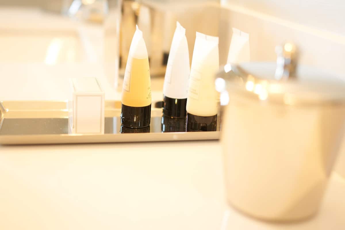 designer toiletries, hair dryer, bathrobes, towels