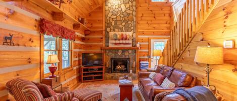 Flat-screen TV, fireplace, DVD player, books