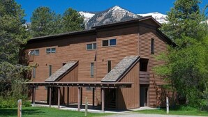 A wooden building with a sloped roof, a covered porch, and a sign that reads "Hotel." - JHRL - Aspens Tamarack 611, perfect for a couple or single vacationers (Wilson)
