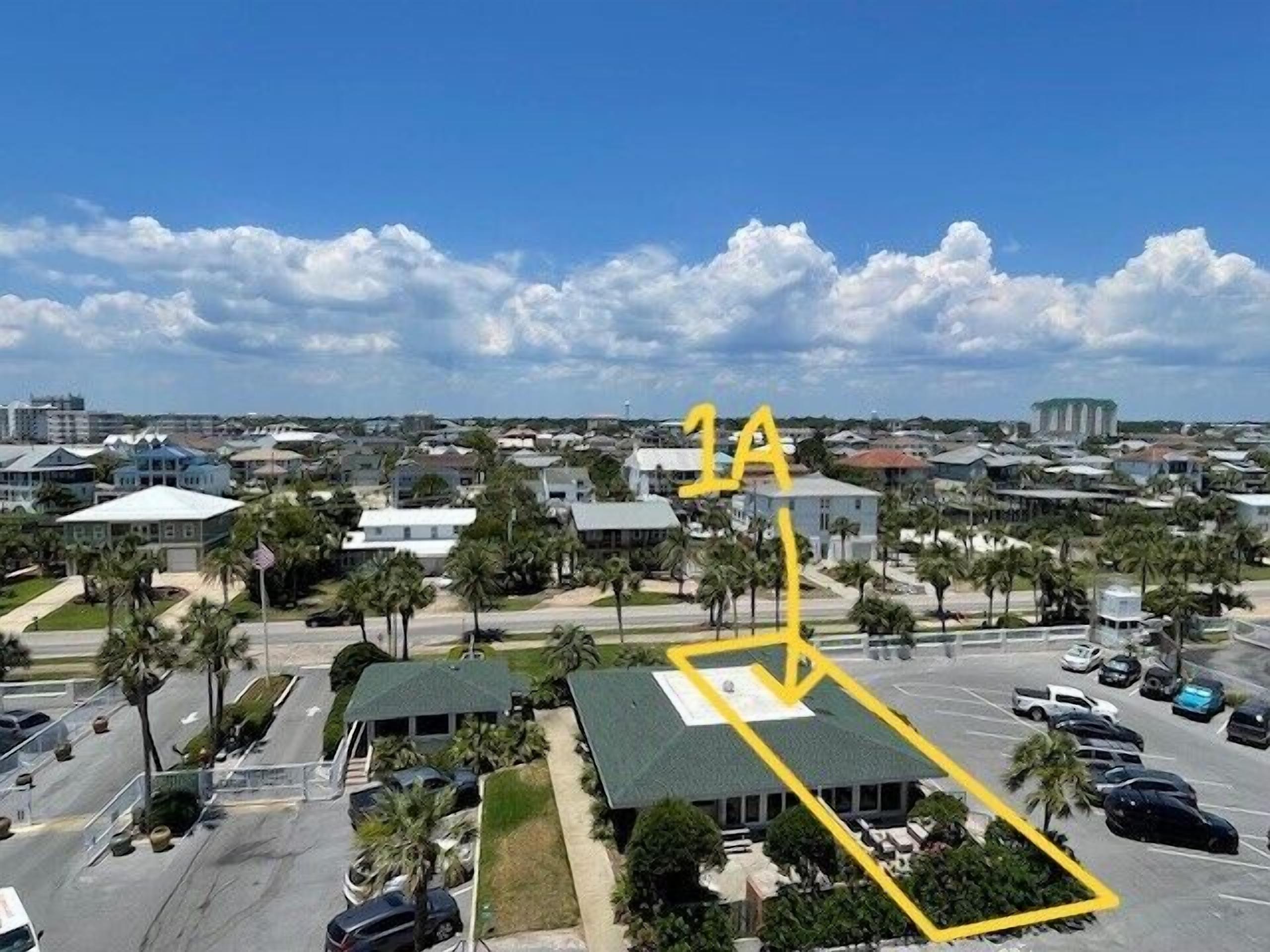 A parking lot with a building in the background.