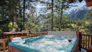 A hot tub with a view of a mountainous landscape. - JHRL - Beautiful Single-Family Granite Ridge Cabin #7590, Hot Tub (Teton Village)