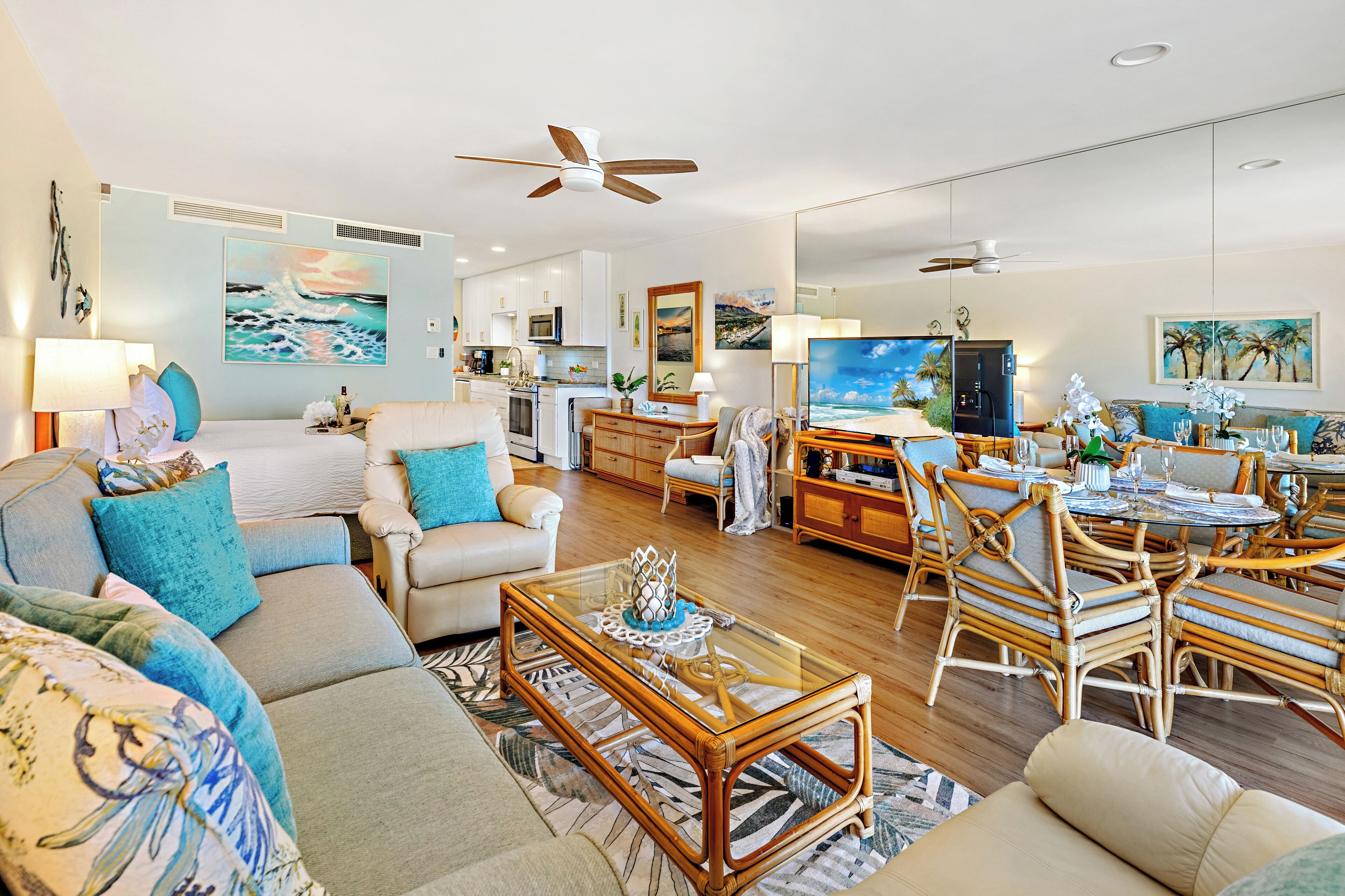A spacious living room with a sofa, coffee table, and dining area.