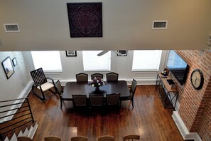 View down to kitchen and dining - Editorial/ Short Story Themed Historic, Luxury condo 3 blocks from the French Quarter (New Orleans)