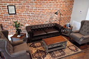 Living Room has wall mount TV - Editorial/ Short Story Themed Historic, Luxury condo 3 blocks from the French Quarter (New Orleans)
