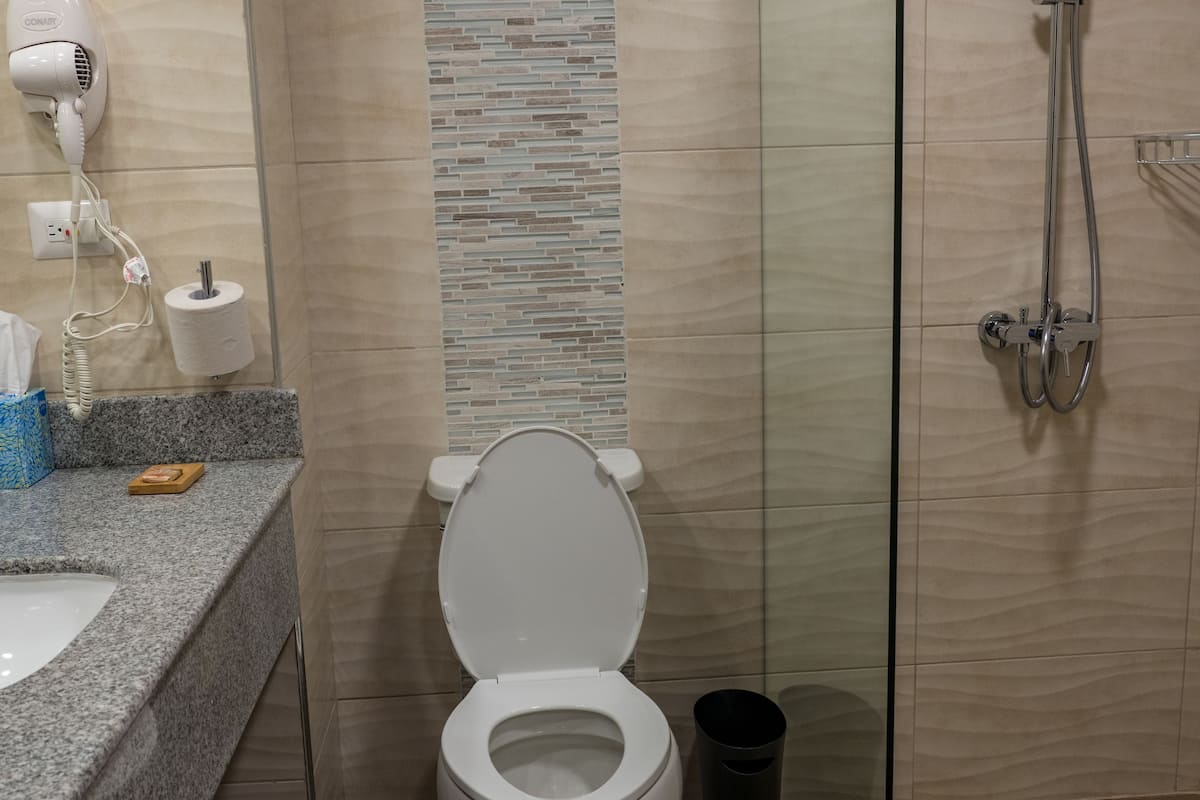 superior double room, 2 queen beds, city view, sea facing | in-room safe, desk, iron/ironing board, free rollaway beds