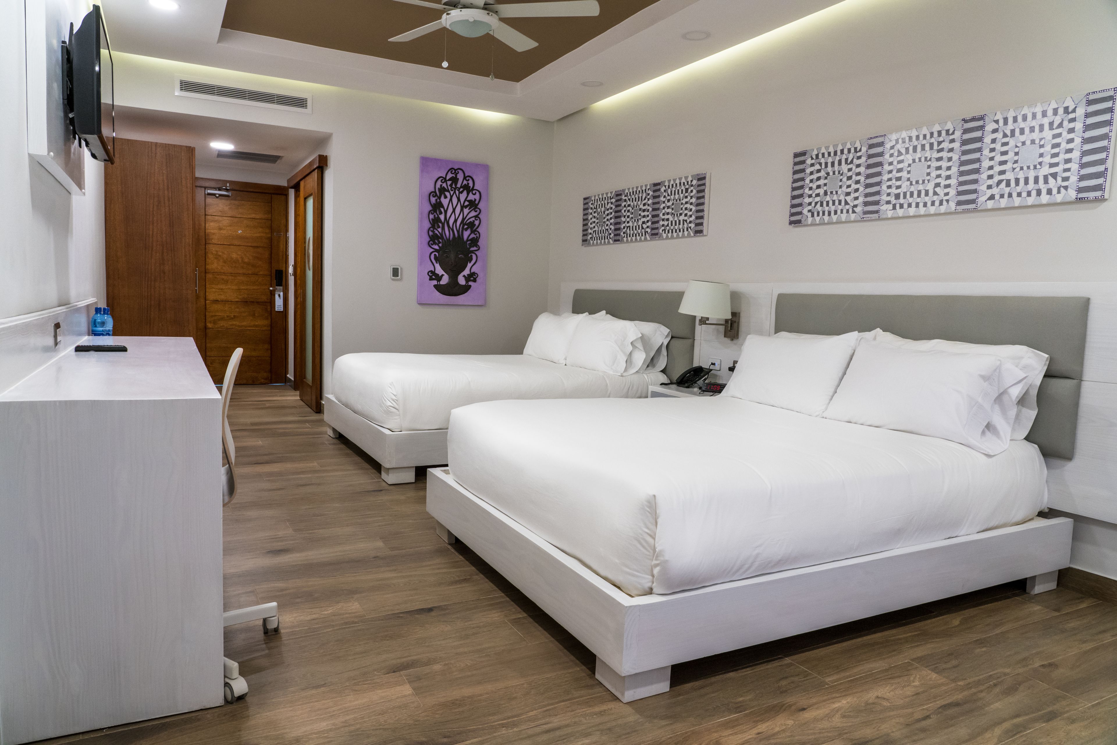 superior double room, 2 queen beds, city view, sea facing | in-room safe, desk, iron/ironing board, free rollaway beds