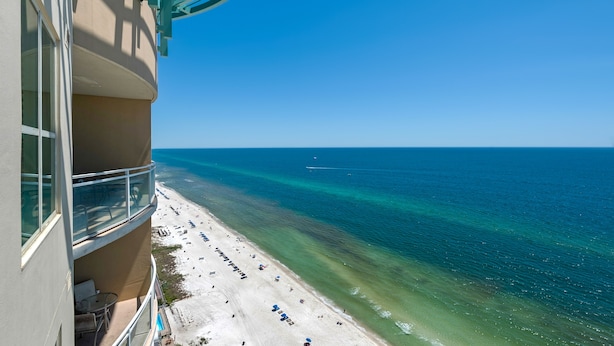 A balcony with a view of a beach and ocean. - 2306 - Nautical Style Couples Retreat (Panama City Beach)