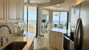 A modern kitchen with a large island, stainless steel appliances, and a view of the ocean. - 2 Free Beach SRVCS- 4 chairs/2 umbrellas! Free Beach Bonfires M/F nts (Miramar Beach)