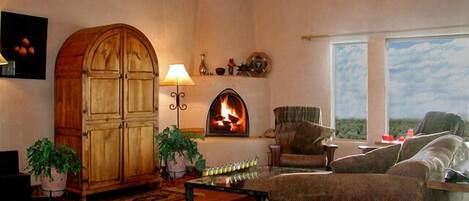 Télévision, cheminée, lecteur de DVD