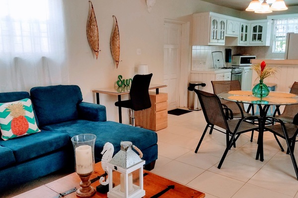 Island inspired living and dining room with workspace