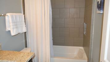 Bathroom has tub / shower combo