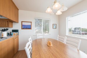 Enjoy meals at the dining table surrounded by comfortable chairs.