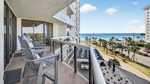A balcony with outdoor seating and a view of the beach and ocean. - FREE Beach SRVC! Free Beach Bonfires M/F! Ocean Views! (Miramar Beach)