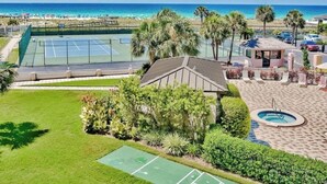 A tennis court, a pool, and a beach view. - 🌅 Islander #304 – Affordable Beach Getaway with Amazing Sunrises! 🌊✨ (Destin)