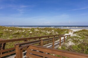 A wooden boardwalk leading to a beach with sand dunes and ocean views. - Beautiful Top Floor (Elevator Building) Ocean View Condo - Excellent Location! (Saint Augustine)