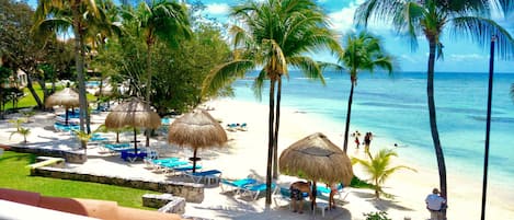 On the beach, sun-loungers, beach towels