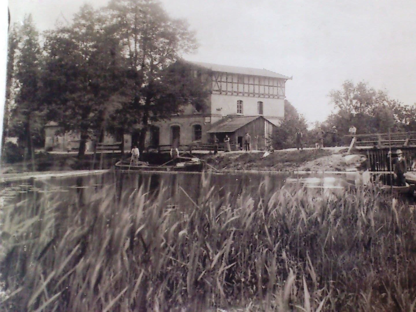 A historical building with a large, central tower and a smaller structure attached to it.