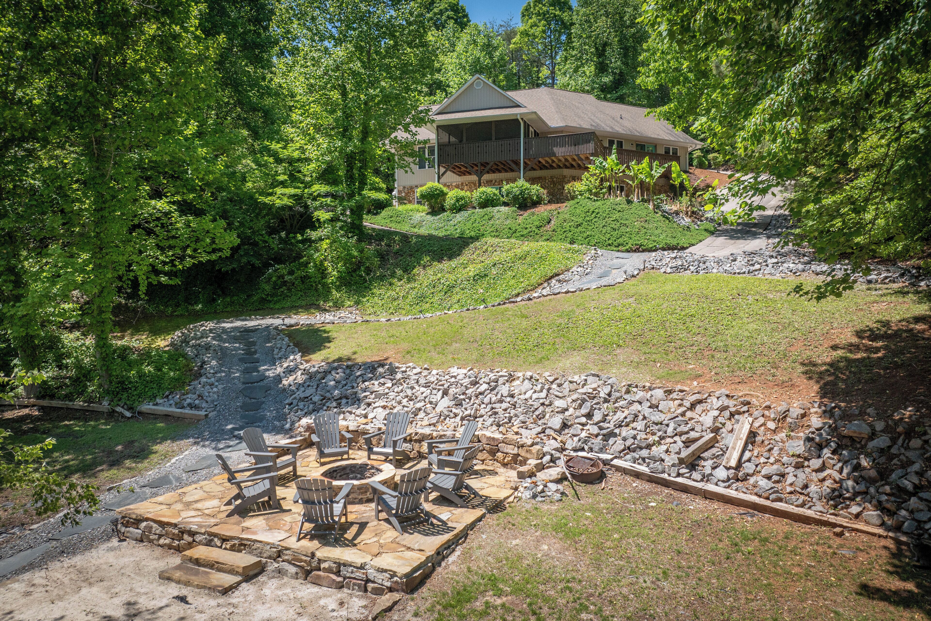 A house with a stone patio and outdoor seating area.