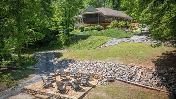 A house with a stone patio and outdoor seating area.