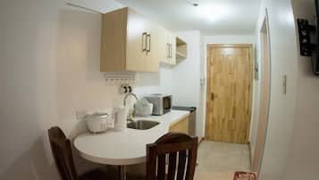 Twin Studio | Private kitchenette | Full-sized fridge, microwave, stovetop, electric kettle