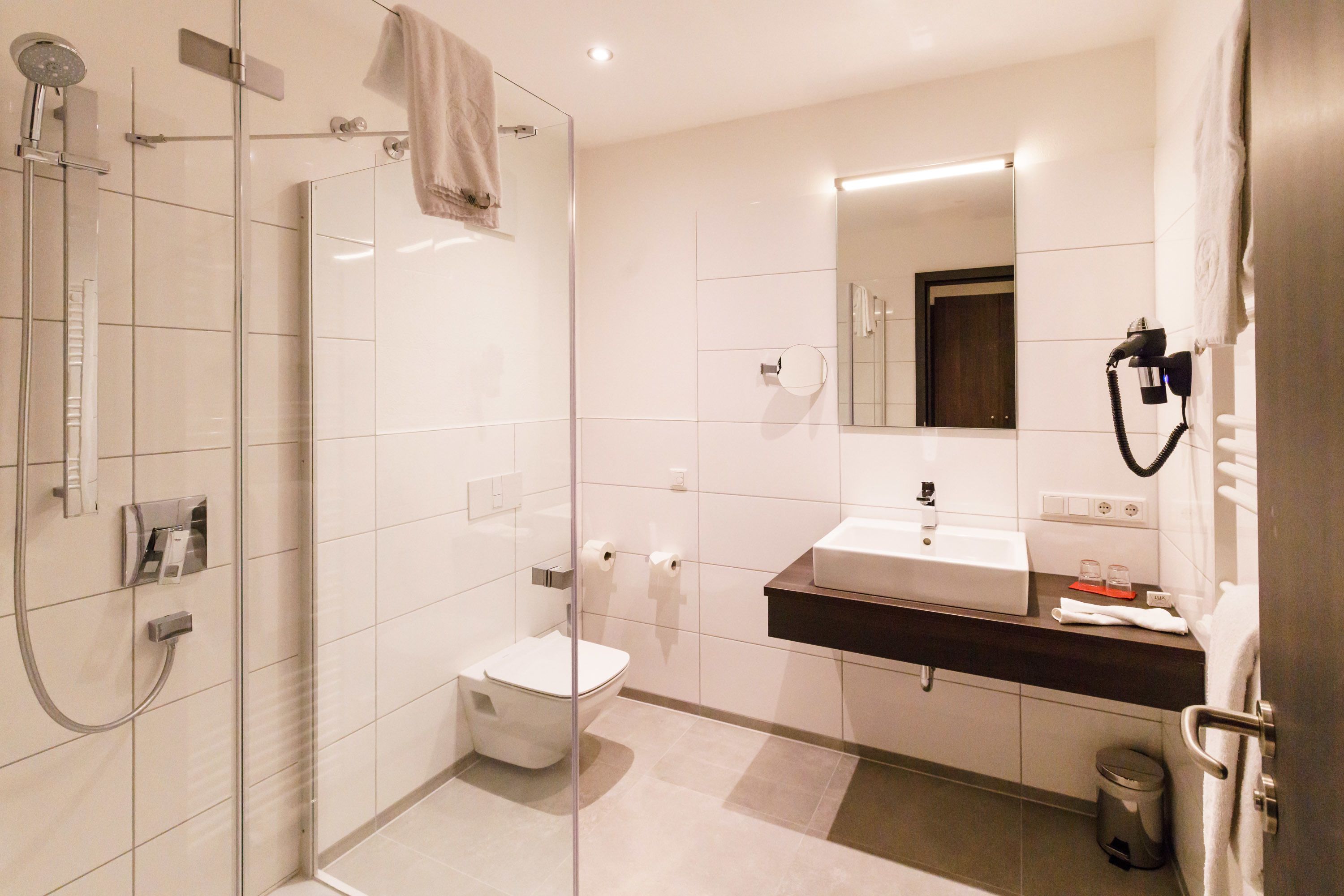 shower, hair dryer, heated floors, towels