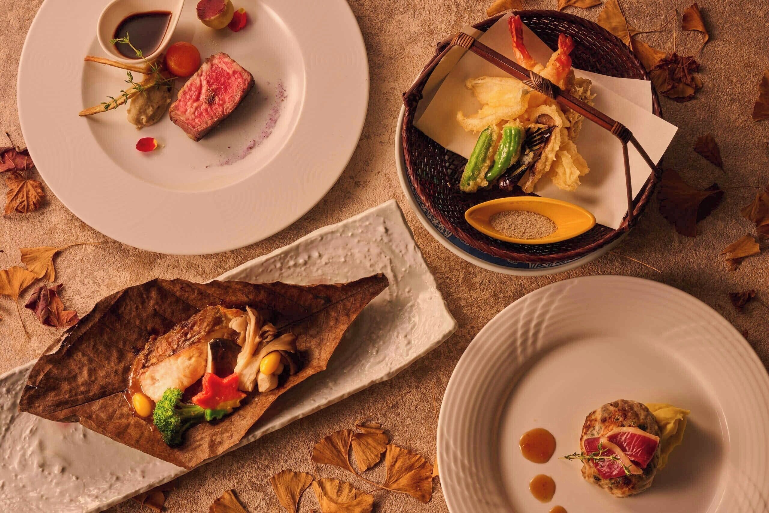 A variety of dishes on plates, including a steak, seafood, and vegetables.