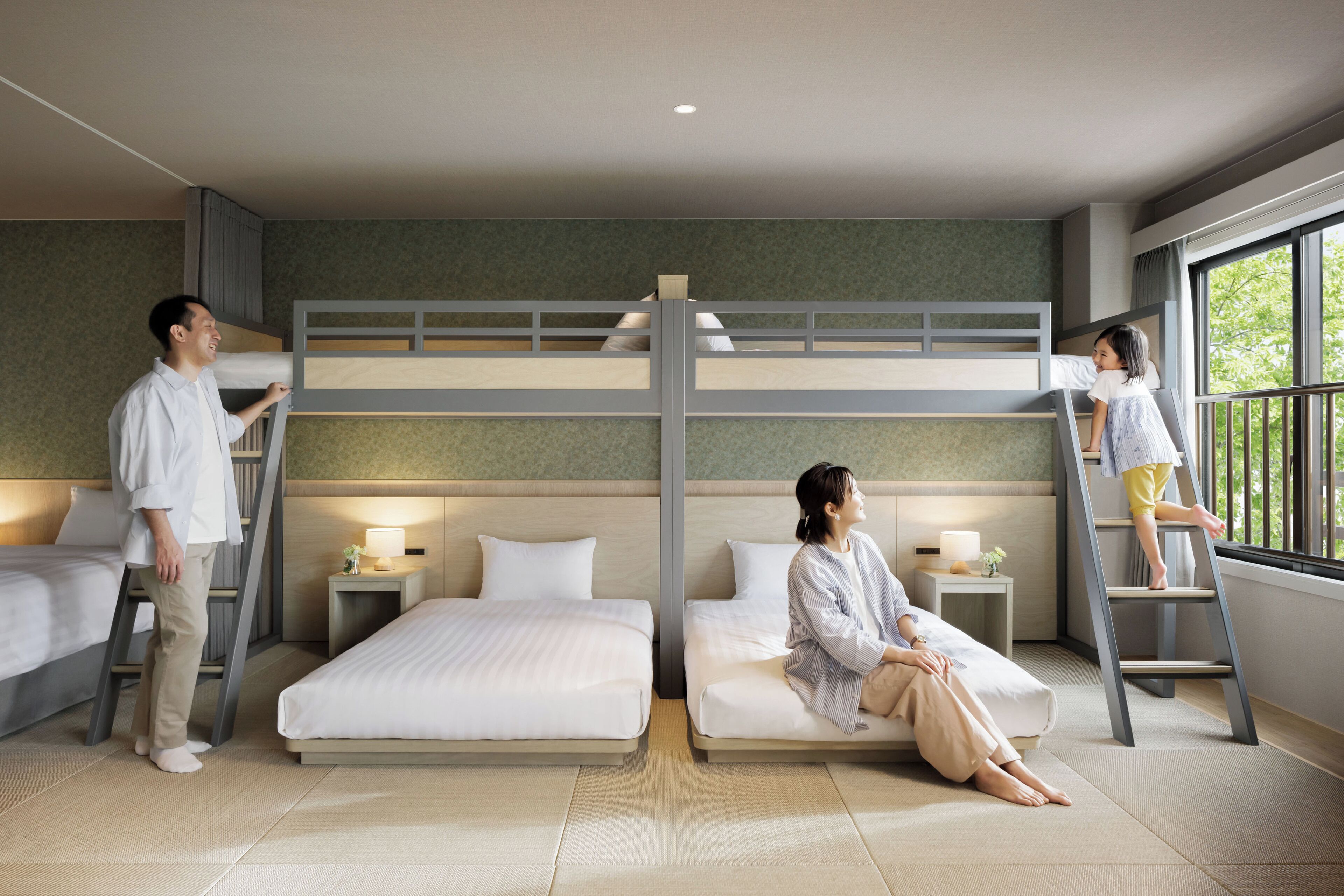 A hotel room with bunk beds, a ladder, bedside tables with lamps, and a large window.