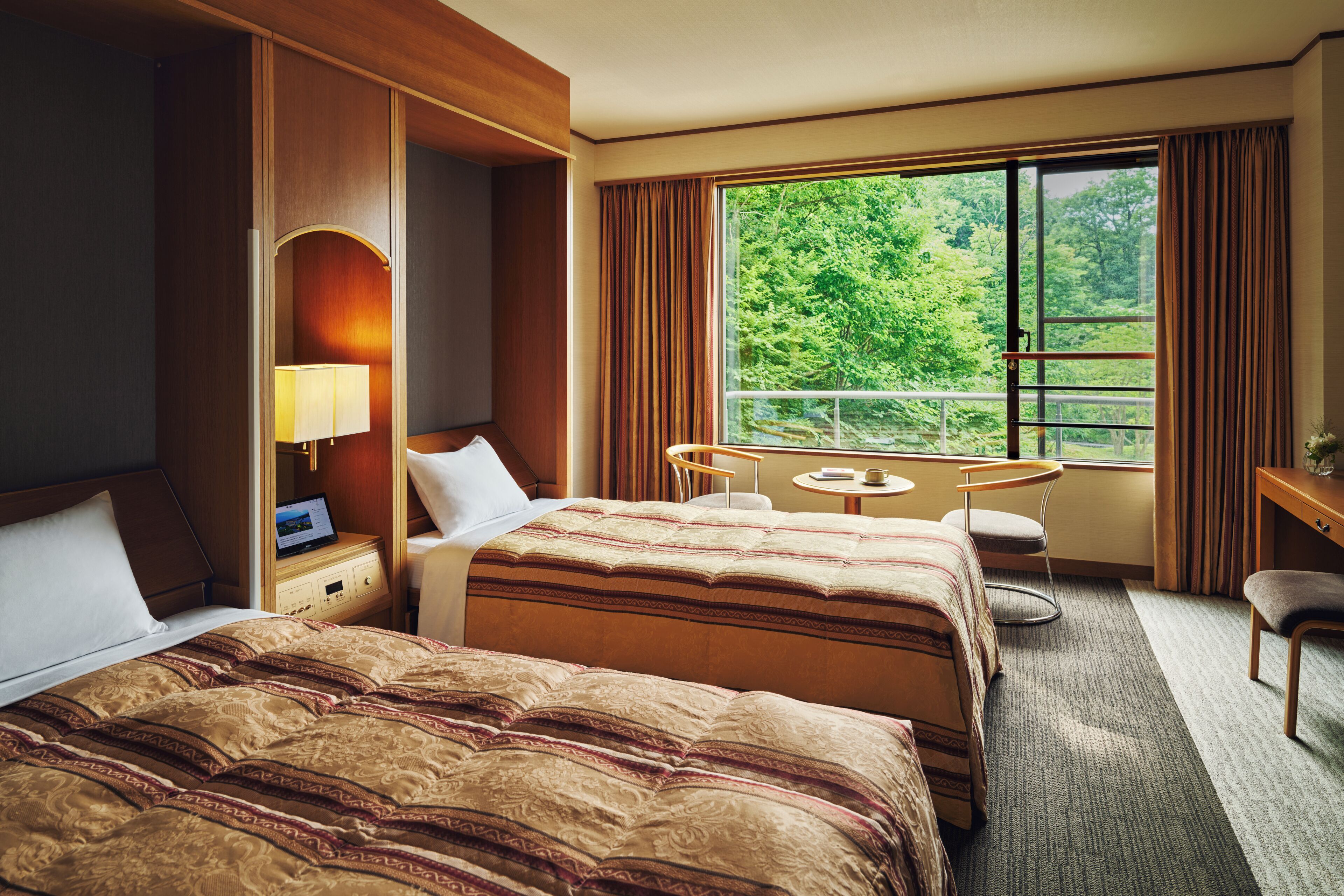Chambre économique avec lits jumeaux | Coffre-fort, accès au Wi-Fi (inclus), literie fournie